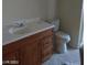 Bathroom with a wood vanity, modern faucet and toilet at 1608 N Torrey Pines Dr # 103, Las Vegas, NV 89108
