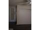 Bedroom featuring a closet with sliding doors and modern gray flooring at 1608 N Torrey Pines Dr # 103, Las Vegas, NV 89108
