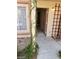 Welcoming front entrance with decorative trellis, climbing vines and covered porch at 1608 N Torrey Pines Dr # 103, Las Vegas, NV 89108