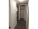Hallway leading to bedroom with spacious closet and neutral color palette at 1608 N Torrey Pines Dr # 103, Las Vegas, NV 89108