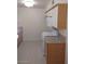 Efficient kitchen layout with modern white appliances and ample cabinet space at 1608 N Torrey Pines Dr # 103, Las Vegas, NV 89108