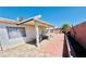 Enjoy the outdoors in this covered patio, ideal for al fresco dining and entertaining with a brick-paved walkway at 1860 Banaba Ln, Las Vegas, NV 89156