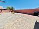 Expansive backyard featuring unique landscaping, a built-in grill, and a spacious brick-paved patio at 1860 Banaba Ln, Las Vegas, NV 89156
