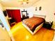 Bright bedroom with wood floors, stylish decor, and a ceiling fan at 1860 Banaba Ln, Las Vegas, NV 89156