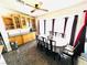 Bright dining area with stylish table set, cabinets, and ceiling fan at 1860 Banaba Ln, Las Vegas, NV 89156