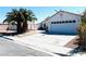 Charming single-story home with a well-maintained front yard, desert landscaping, and a two-car garage at 1860 Banaba Ln, Las Vegas, NV 89156