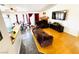Spacious living room featuring hardwood floors, a ceiling fan, and access to the dining area at 1860 Banaba Ln, Las Vegas, NV 89156