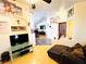 Comfortable living room featuring hardwood floors, a ceiling fan, and ample natural light at 1860 Banaba Ln, Las Vegas, NV 89156