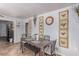 Bright dining space features tiled floors, neutral walls, and decorative butterfly wall art at 201 Cervantes St, Las Vegas, NV 89101