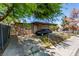 Charming single-story home features stone accents, a covered parking area, and mature landscaping at 201 Cervantes St, Las Vegas, NV 89101
