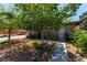 Landscaped front yard showcases a quaint home with stone and brick, offering curb appeal at 201 Cervantes St, Las Vegas, NV 89101