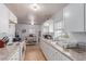 Functional kitchen with white cabinets, tile flooring, and modern appliances ready for the home chef at 201 Cervantes St, Las Vegas, NV 89101