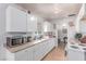 Bright kitchen with white cabinets and tile flooring, offering ample countertop space at 201 Cervantes St, Las Vegas, NV 89101