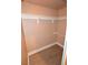 Walk-in closet with wood-look flooring, and built-in shelving, enhancing organization, and maximizing space at 220 E Flamingo Rd # 116, Las Vegas, NV 89169