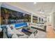 Inviting covered patio with comfortable seating, dining area, and views of the beautifully landscaped backyard and pool at 2231 S Tioga Way, Las Vegas, NV 89117