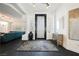 Bright foyer with modern decor, tile flooring, and an elegant front door at 2231 S Tioga Way, Las Vegas, NV 89117