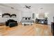 A bright and spacious main bedroom with light hardwood floors, neutral tones, and elegant furnishings at 2231 S Tioga Way, Las Vegas, NV 89117