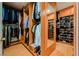 A well-organized walk-in closet with wooden shelves and rods for ample clothing and shoe storage at 2231 S Tioga Way, Las Vegas, NV 89117