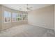Spacious bedroom with large windows offering ample natural light and plush carpeting at 2284 Carambala Ln, Henderson, NV 89044
