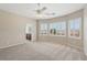 Bright bedroom with an ensuite bathroom, large windows, and neutral tones at 2284 Carambala Ln, Henderson, NV 89044