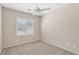 Comfortable bedroom with natural light from window, ceiling fan and carpeting at 2284 Carambala Ln, Henderson, NV 89044