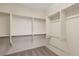Walk-in closet with multiple shelves and rods for optimal storage solutions at 2284 Carambala Ln, Henderson, NV 89044