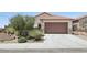 Charming single-story home with desert landscaping and a spacious two-car garage at 2284 Carambala Ln, Henderson, NV 89044