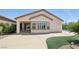 Rear exterior featuring a patio, manicured lawn, and a partial view of the swimming pool at 2284 Carambala Ln, Henderson, NV 89044