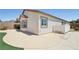 Rear exterior featuring a covered patio, and artificial lawn at 2284 Carambala Ln, Henderson, NV 89044