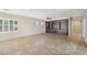 Spacious living room with tile flooring and a built-in entertainment center for modern living and organization at 2284 Carambala Ln, Henderson, NV 89044