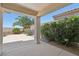 Covered patio with lush greenery and view of landscaping creating a private outdoor space at 2284 Carambala Ln, Henderson, NV 89044