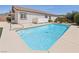 Backyard pool with patio area, privacy wall and desert landscaping, perfect for outdoor living at 2284 Carambala Ln, Henderson, NV 89044