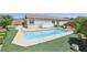 Backyard pool with surrounding turf and patio space perfect for outdoor relaxation at 2284 Carambala Ln, Henderson, NV 89044