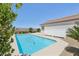 Backyard pool with patio, privacy wall and desert landscaping at 2284 Carambala Ln, Henderson, NV 89044