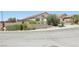 Well-maintained neighborhood street showcasing tiered landscaping and attractive home exteriors at 2284 Carambala Ln, Henderson, NV 89044