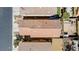 Aerial view of a home with a tile roof and fenced backyard, surrounded by neighboring houses at 236 Dog Leg Dr, Las Vegas, NV 89148