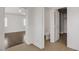 Bright and airy bathroom with a toilet and wood floors, next to the bedroom at 236 Dog Leg Dr, Las Vegas, NV 89148