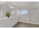 Bathroom featuring a double vanity sink with white cabinets, soaking tub and shower at 236 Dog Leg Dr, Las Vegas, NV 89148