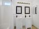 Bright bathroom with double sinks, neutral walls and flooring, and a shower/tub at 236 Dog Leg Dr, Las Vegas, NV 89148