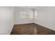 Bedroom showcasing laminate flooring and large windows at 236 Dog Leg Dr, Las Vegas, NV 89148