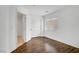 Bright bedroom with hardwood floors, white walls, a large closet and window with blinds at 236 Dog Leg Dr, Las Vegas, NV 89148