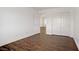 Well-lit bedroom with laminate flooring, closet space, and bright white walls at 236 Dog Leg Dr, Las Vegas, NV 89148