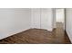 Bedroom highlighting laminate flooring and a large closet with sliding doors at 236 Dog Leg Dr, Las Vegas, NV 89148
