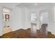 View from hallway to a bedroom and bathroom, both featuring hardwood flooring and white walls at 236 Dog Leg Dr, Las Vegas, NV 89148