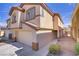 Well-kept two-story home boasts a two-car garage and low-maintenance front yard at 236 Dog Leg Dr, Las Vegas, NV 89148