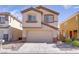 Charming two-story home with a two-car garage and well-maintained landscaping at 236 Dog Leg Dr, Las Vegas, NV 89148