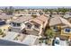 Aerial view of a two-story home with a two car garage and well-maintained front yard landscaping at 236 Dog Leg Dr, Las Vegas, NV 89148