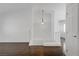 Hallway area featuring hardwood floors, white walls, and a decorative pendant light at 236 Dog Leg Dr, Las Vegas, NV 89148