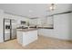 Bright kitchen featuring stainless steel appliances, an island, and light colored cabinets at 236 Dog Leg Dr, Las Vegas, NV 89148
