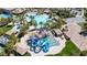 Aerial view of the water park with various slides, pools, palm trees, and recreational area at 236 Dog Leg Dr, Las Vegas, NV 89148